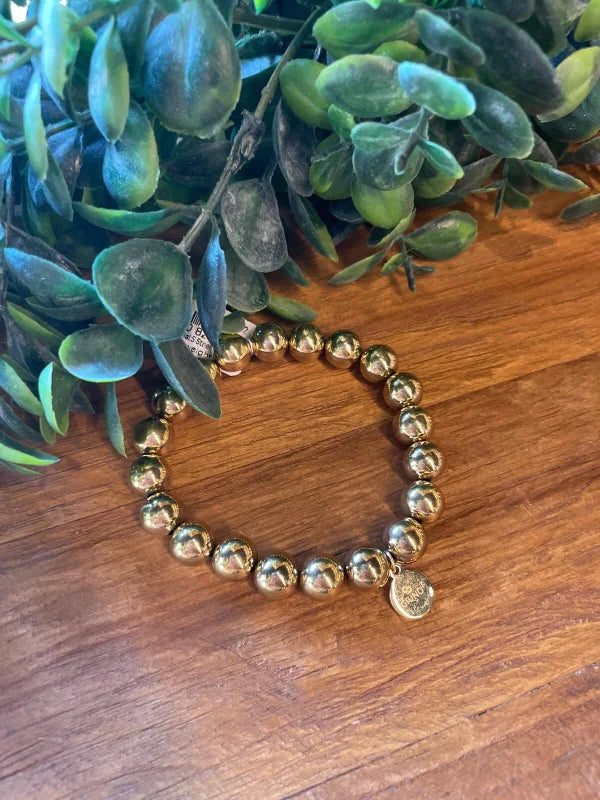 Elastieken gouden kralenarmband