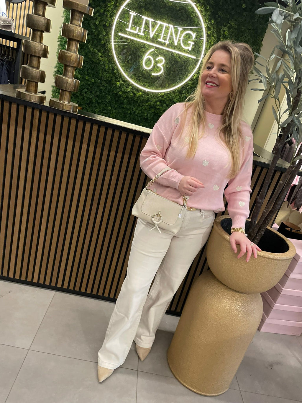 Roze trui met witte hartjes